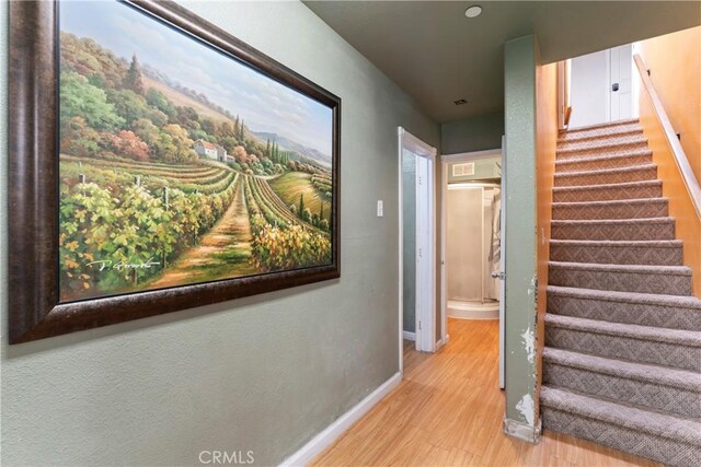 2745 Deer Creek Dr, Running Springs, CA 92382 - stairs featuring wood finished floors and baseboards