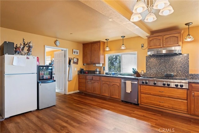 2745 Deer Creek Dr, Running Springs, CA 92382 - kitchen with stainless steel appliances, ventilation hood, a chandelier, dark countertops, and beamed ceiling