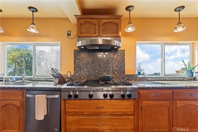 2745 Deer Creek Dr, Running Springs, CA 92382 - kitchen with appliances with stainless steel finishes, exhaust hood, brown cabinetry, and backsplash