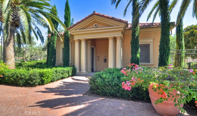 42 Cipresso, Irvine, CA 92618 - view of front of property featuring stucco siding and a tiled roof