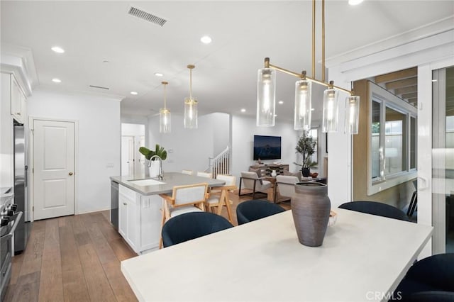 42 Cipresso, Irvine, CA 92618 - dining room featuring hardwood / wood-style floors, stairs, and recessed lighting