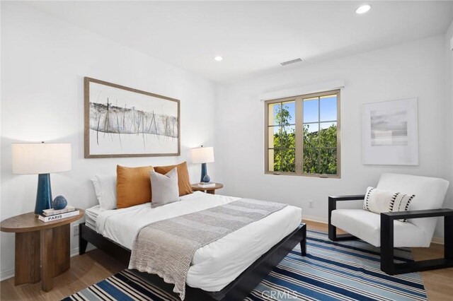 42 Cipresso, Irvine, CA 92618 - bedroom with wood finished floors, baseboards, and recessed lighting