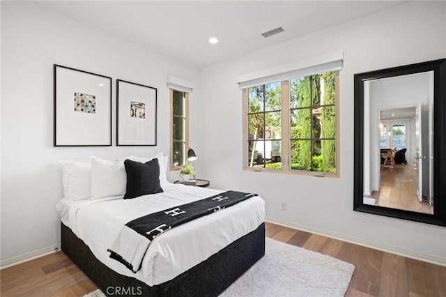 42 Cipresso, Irvine, CA 92618 - bedroom with multiple windows, baseboards, wood finished floors, and recessed lighting