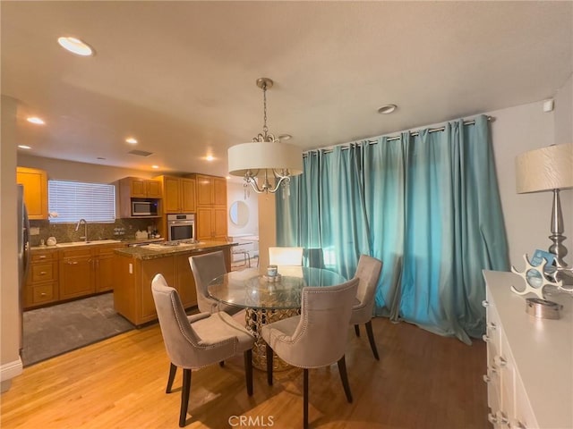 17222 Wall St, Carson, CA 90746 - dining area with recessed lighting, light wood finished floors, a notable chandelier, and visible vents