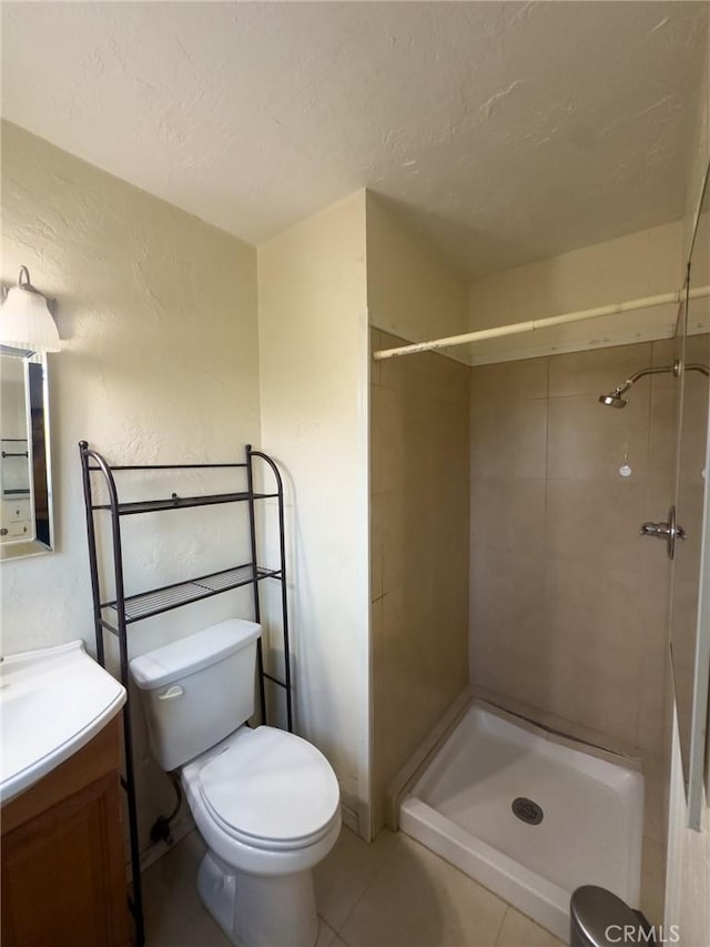 17222 Wall St, Carson, CA 90746 - bathroom featuring tile patterned floors, tiled shower, vanity, and toilet