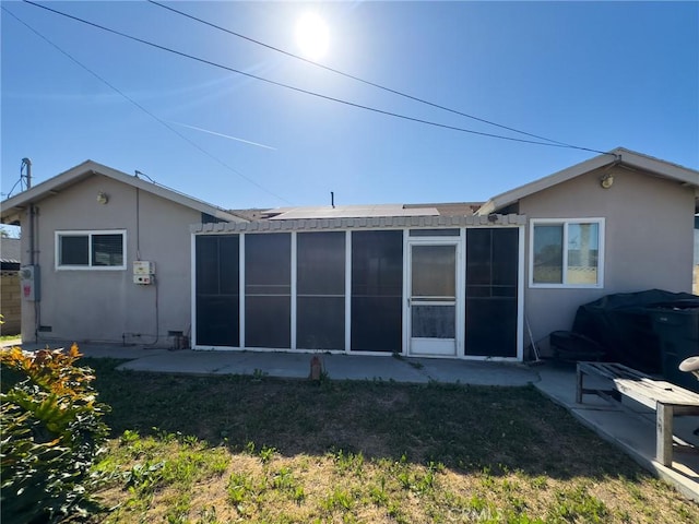 17222 Wall St, Carson, CA 90746 - back of house featuring a sunroom, a patio area, and stucco siding