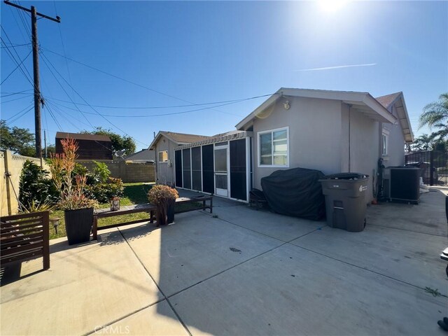 17222 Wall St, Carson, CA 90746 - rear view of property with a patio area, a fenced backyard, central AC, and stucco siding