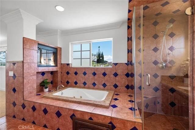 bathroom featuring crown molding, a tub with jets, a wealth of natural light, and a stall shower