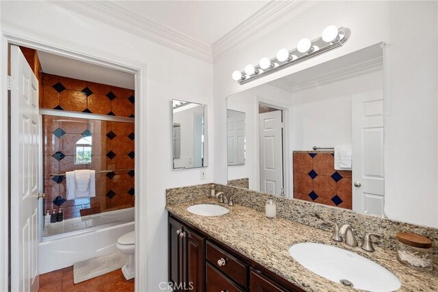 full bathroom featuring crown molding, a sink, tile patterned floors, and toilet
