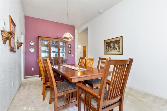 dining space with light carpet