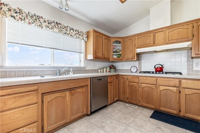 kitchen with dishwasher, a sink, under cabinet range hood, black cooktop, and vaulted ceiling
