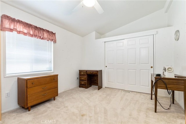 bedroom featuring light carpet, a closet, ceiling fan, and lofted ceiling