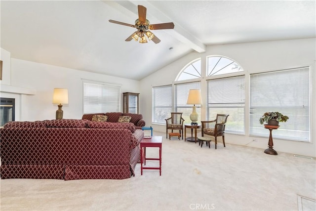 carpeted living room featuring a ceiling fan and vaulted ceiling with beams
