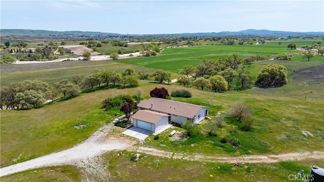 drone / aerial view with a mountain view and a rural view