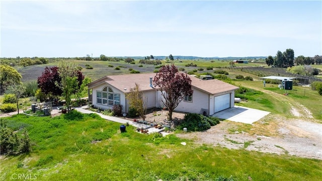 birds eye view of property featuring a rural view