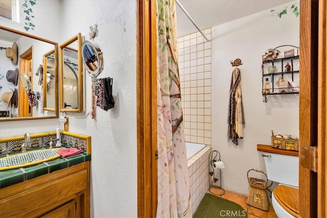 10341 Pinon Ave, Morongo Valley, CA 92256 - full bath featuring toilet, shower / bath combo with shower curtain, vanity, and tile patterned flooring