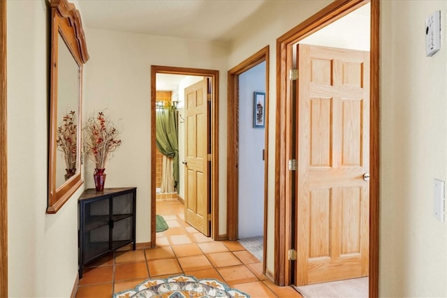 corridor featuring light tile patterned floors
