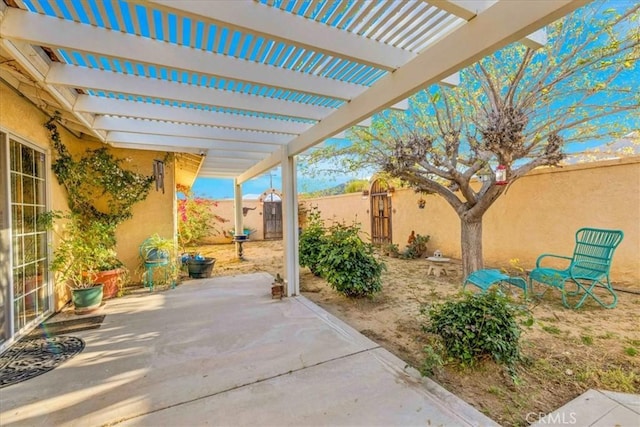 view of patio / terrace featuring a pergola and a fenced backyard