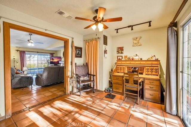 10341 Pinon Ave, Morongo Valley, CA 92256 - office featuring a ceiling fan, light tile patterned flooring, and track lighting