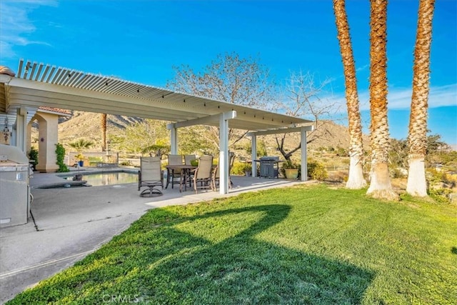 10341 Pinon Ave, Morongo Valley, CA 92256 - view of home's community featuring a yard, a patio, a pergola, and a pool