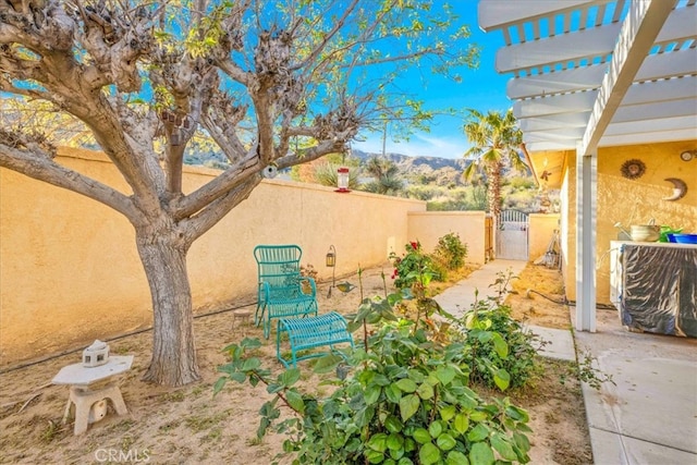10341 Pinon Ave, Morongo Valley, CA 92256 - view of patio featuring a gate and a mountain view