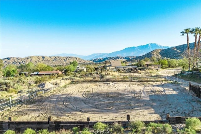 10341 Pinon Ave, Morongo Valley, CA 92256 - surrounding community featuring a mountain view, an enclosed riding area, and a view of countryside