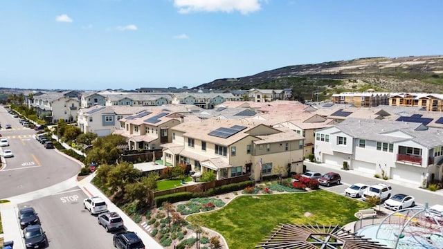birds eye view of property with a residential view and a mountain view