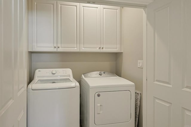 laundry area featuring cabinet space and independent washer and dryer