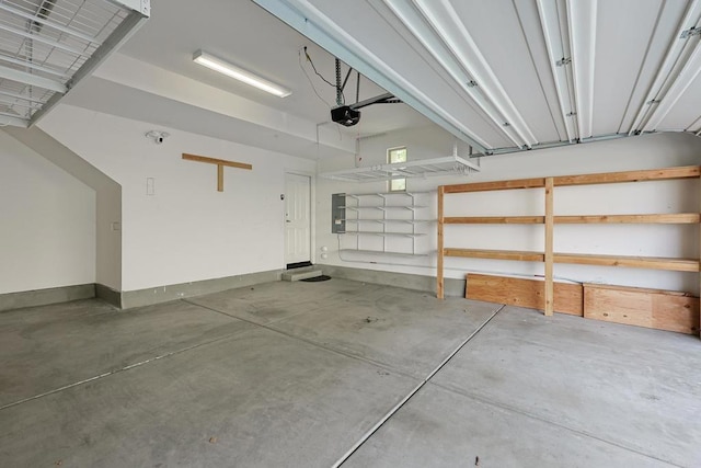 garage featuring a garage door opener and electric panel