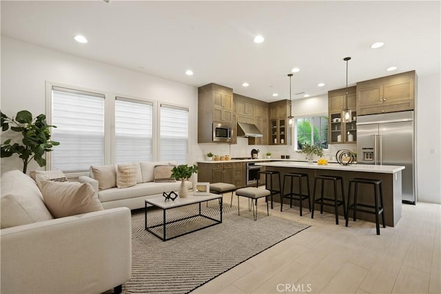 living room featuring recessed lighting and light wood finished floors