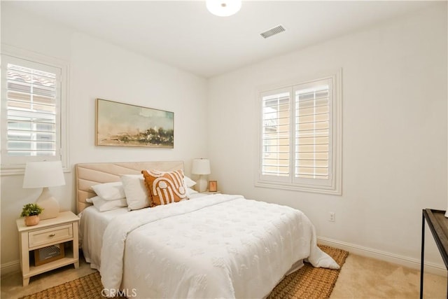 carpeted bedroom with baseboards