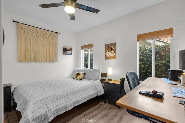 bedroom with wood finished floors and ceiling fan