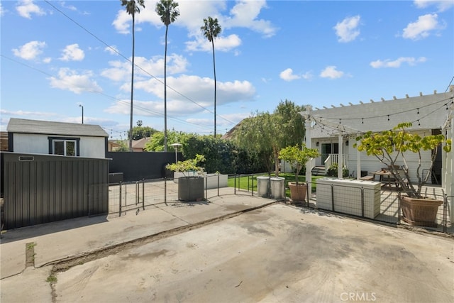 view of patio / terrace with fence and a gate