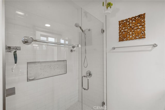 bathroom with a shower stall