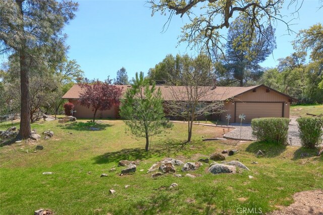 44410 Quail Ct, Coarsegold, CA 93614 - view of yard with an attached garage and driveway