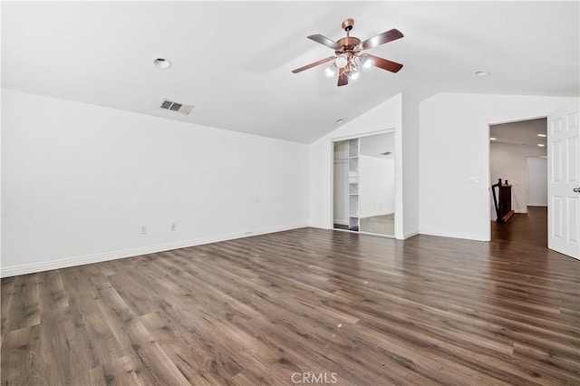unfurnished living room with dark wood-type flooring, visible vents, ceiling fan, and lofted ceiling