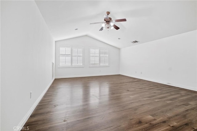 unfurnished living room with lofted ceiling, a ceiling fan, baseboards, and dark wood-style flooring
