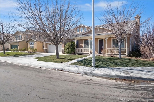 view of front of house with a porch, stucco siding, an attached garage, and driveway