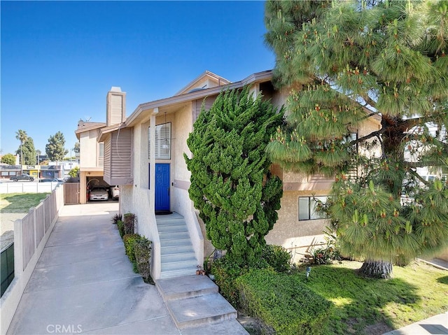 2707 Vanderbilt Ln Unit 1, Redondo Beach, CA 90278 - view of front of property with stucco siding and a chimney