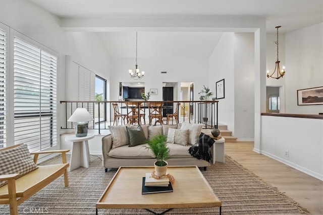 2707 Vanderbilt Ln Unit 1, Redondo Beach, CA 90278 - living area featuring a chandelier, high vaulted ceiling, light wood finished floors, and beam ceiling