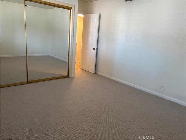 2707 Vanderbilt Ln Unit 1, Redondo Beach, CA 90278 - unfurnished bedroom featuring a closet and carpet flooring