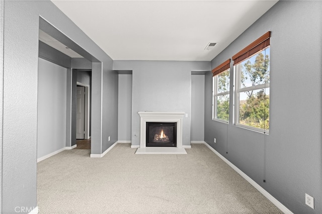 16219 Skyridge Dr, Riverside, CA 92503 - unfurnished living room with carpet flooring, a glass covered fireplace, and baseboards