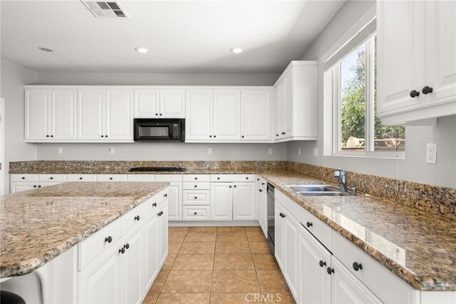 16219 Skyridge Dr, Riverside, CA 92503 - kitchen with a sink, black microwave, stainless steel dishwasher, white cabinets, and recessed lighting