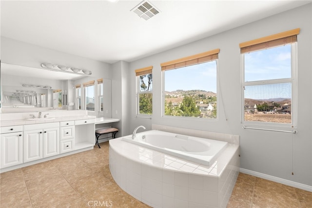 16219 Skyridge Dr, Riverside, CA 92503 - bathroom featuring vanity, a garden tub, tile patterned flooring, and baseboards
