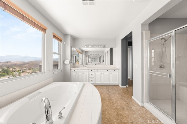 16219 Skyridge Dr, Riverside, CA 92503 - full bath featuring vanity, a tub with jets, a shower stall, and a mountain view