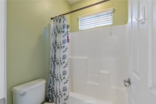 full bath featuring shower / bath combo and toilet