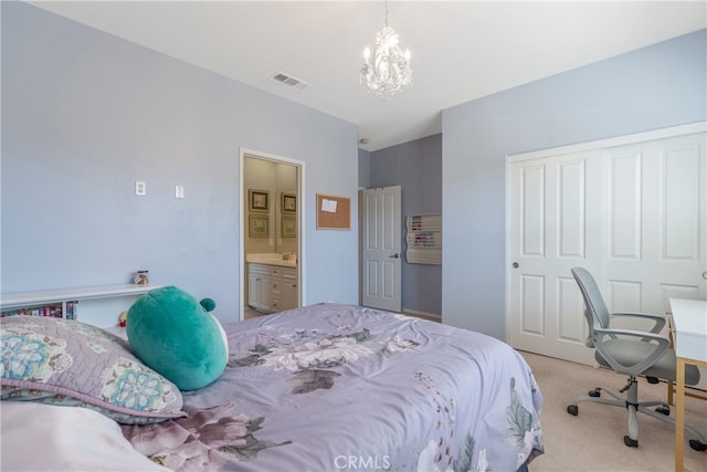 bedroom with carpet, visible vents, ensuite bath, a closet, and a notable chandelier