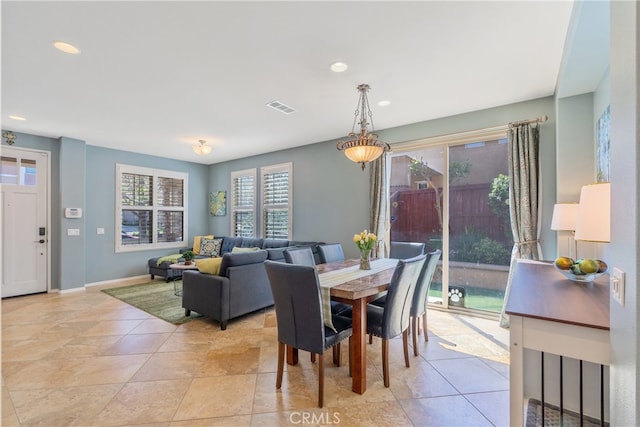 dining room featuring baseboards, visible vents, and recessed lighting