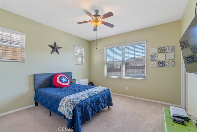 bedroom with baseboards, carpet flooring, and ceiling fan