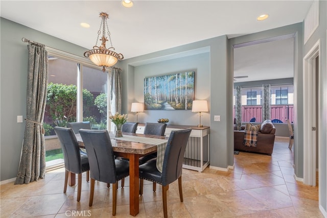 dining area featuring recessed lighting, baseboards, and light tile patterned floors